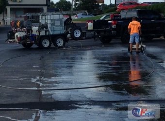 Commercial parking lot being pressure washed