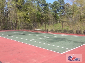 Dirty tennis court before pressure washing