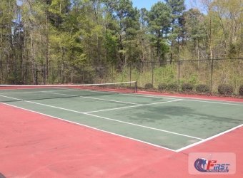 Dirty tennis court before pressure washing