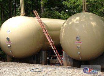Clean industrial propane storage tanks after commercial pressure washing service