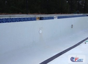 Clean swimming pool surface after pressure washing