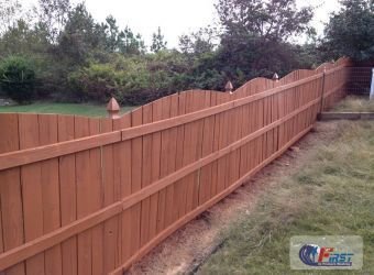 Clean wooden fence after pressure washing