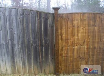 Weathered wooden fence before pressure washing