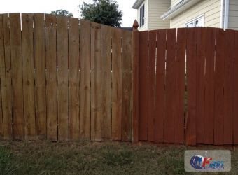 Clean wooden fence after pressure washing
