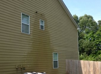Clean vinyl house siding after pressure washing