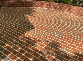 Clean brick patio after pressure washing