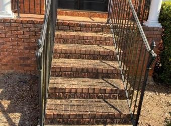 Brick front steps before pressure washing