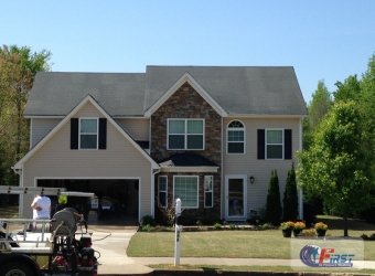 Clean house exterior siding after pressure washing